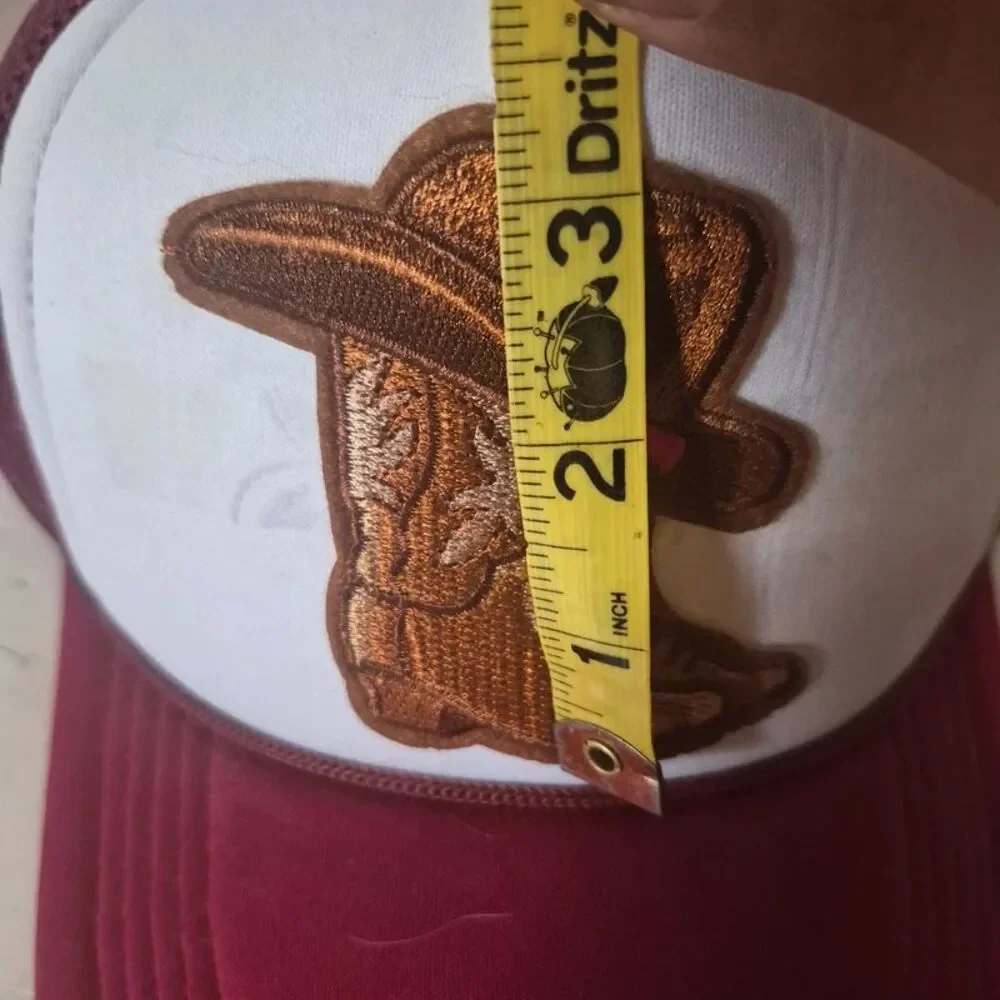 Red polyester mesh trucker hat with cowboy hat/boots iron on